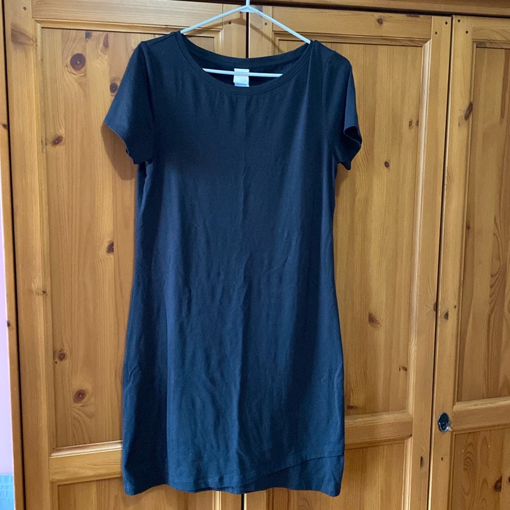 Black Lole shirt dress with detailing at the hem.